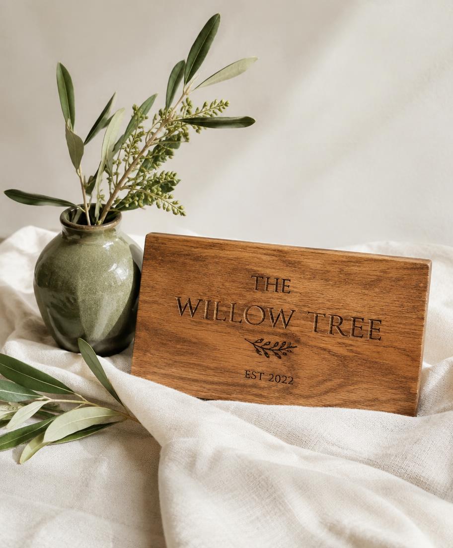 An engraved custom oak sign